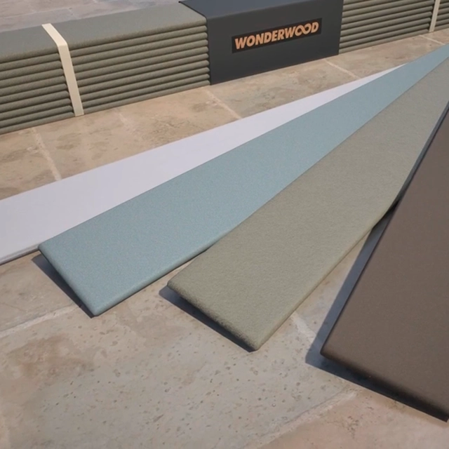 Several rectangular panels in different colors are laid out on a tiled surface, with stacked panels and a "WONDERWOOD" sign in the background.